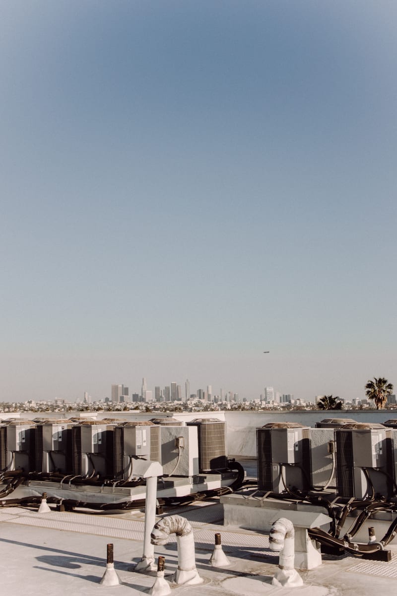 Los Angeles commercial roof with membrane field, HVAC units, curbs, and pipe penetrations